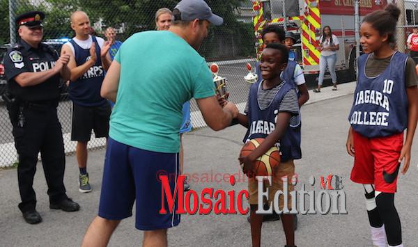 Mayor of St. Catharines, Walter Sendzik presents trophy - Manchester youth challenge Mayor – Police – EMS to Basketball Tournament - mosaicedition.ca-ea